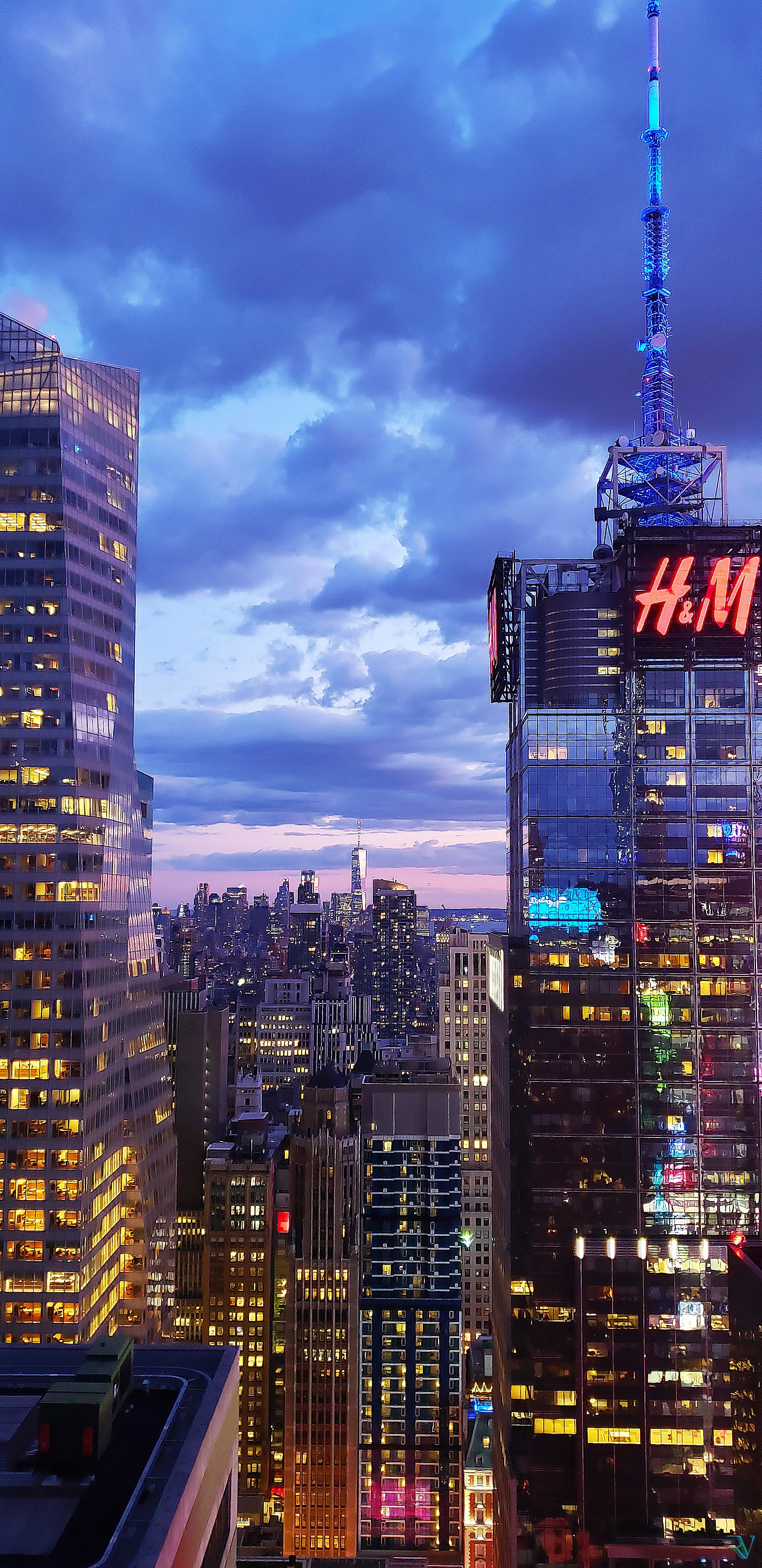 Vertical view over Midtown Manhattan glowing during blue hour